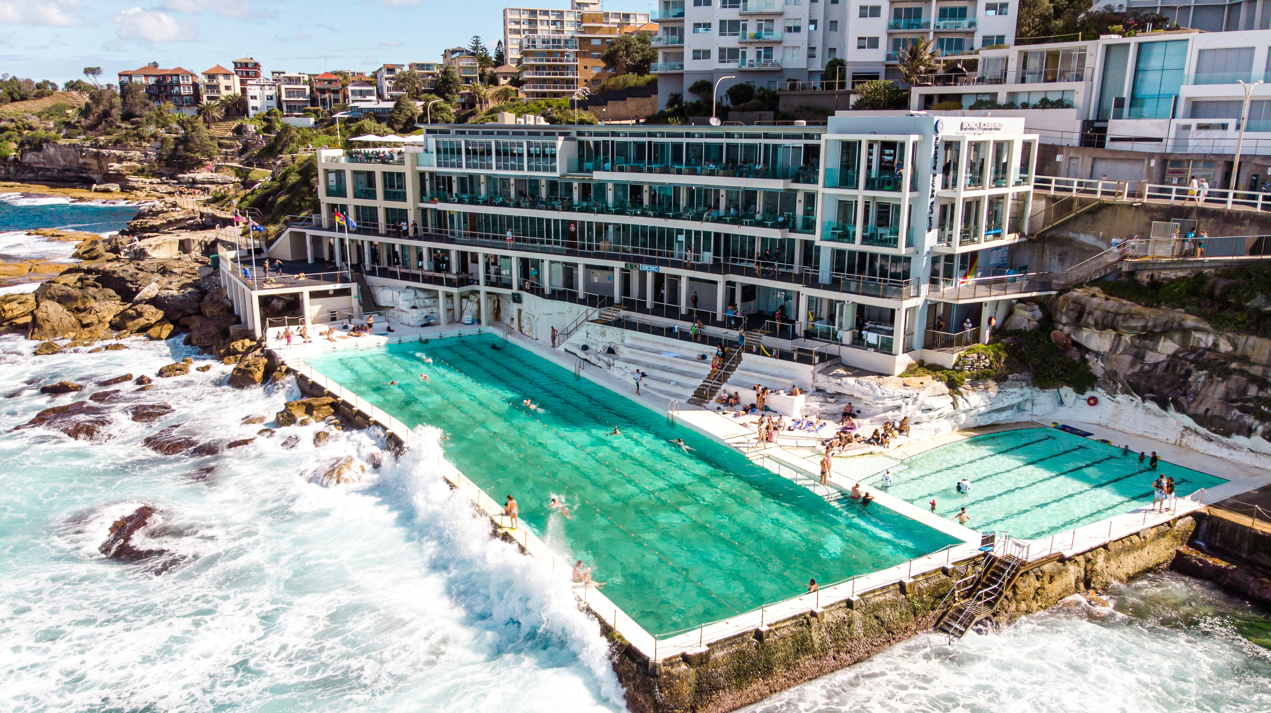 Oceanfront pool at Bondi Icebergs with waves crashing against the deck